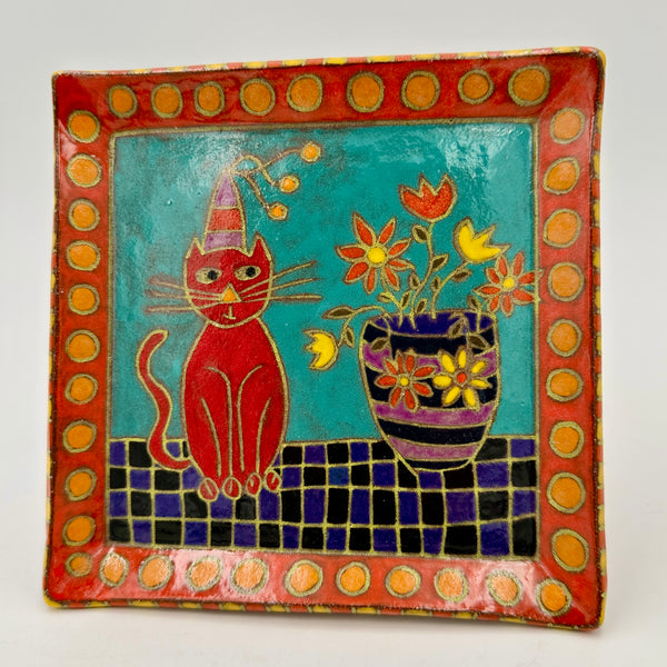 Red Cat sitting with Flower Vase