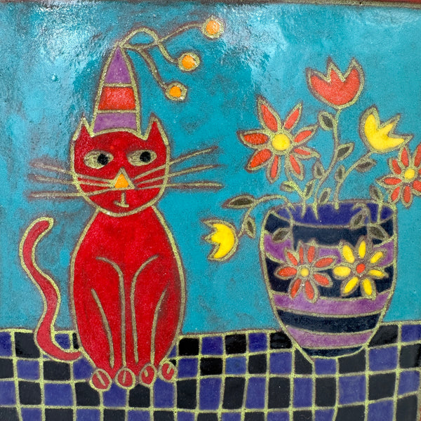Red Cat sitting with Flower Vase